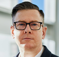 Portrait du PDG d'Alexander Hughes, cadre de la plateforme de trading de crypto-monnaies
